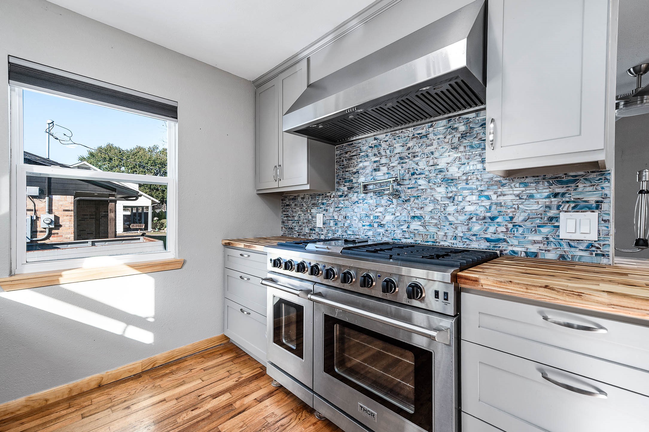 2738 Lilac Street Pasadena, TX 77503 - Photo 10 of 26 a stove top oven sitting inside of a kitchen