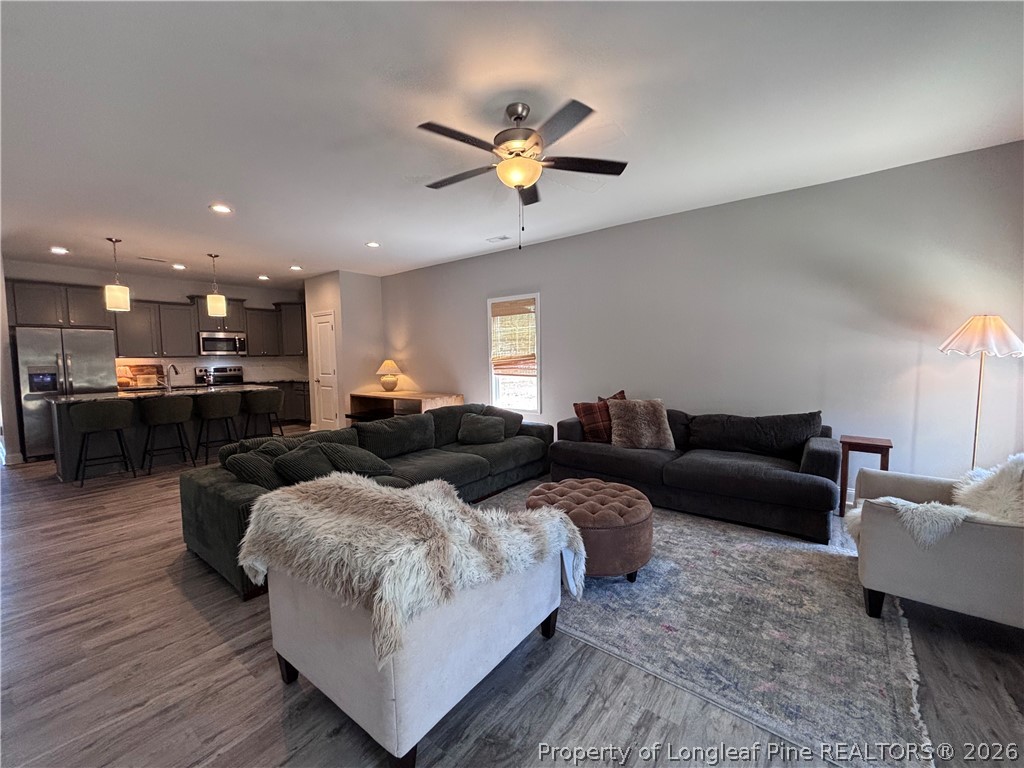 7720 Rufus Johnson Road Fayetteville, NC 28306 - Photo 32 of 50 a living room with furniture and a view of kitchen