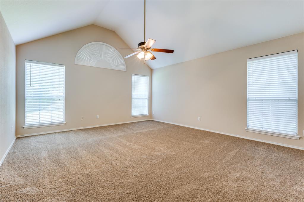 2603 Tourette Court McKinney, TX 75070 - Photo 8 of 16 a view of a livingroom with a ceiling fan and window