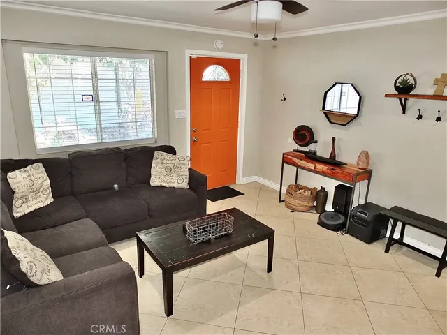a kitchen with stainless steel appliances a stove a sink cabinets and a dining table