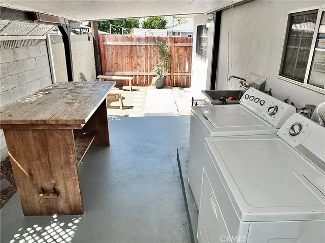 a view of a patio with a table and chairs