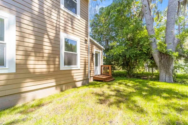 a aerial view of a house with swimming pool and garden