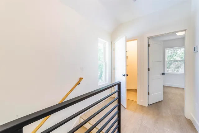 a view of front door with wooden floor