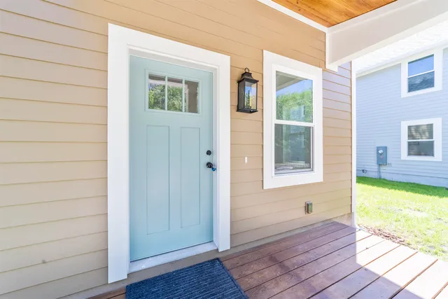 a view of front door and bedroom