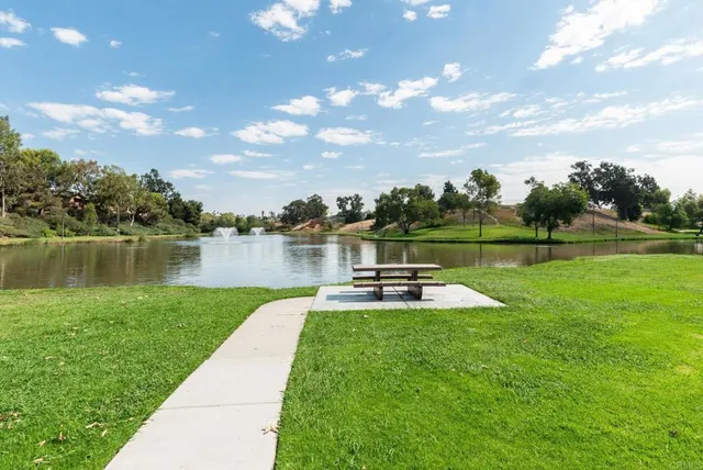 a view of a swimming pool and a patio
