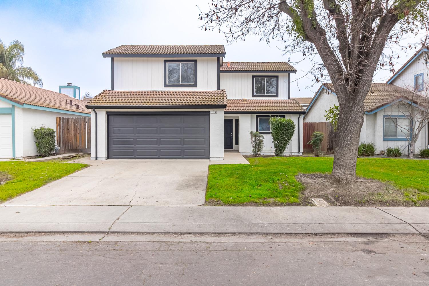 1128 Diablo Avenue Modesto, CA 95358 - Photo 1 of 23 a front view of house with yard and green space