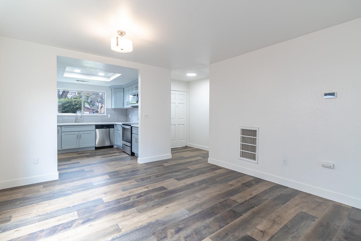 1128 Diablo Avenue Modesto, CA 95358 - Photo 11 of 23 a view of a room with kitchen and windows
