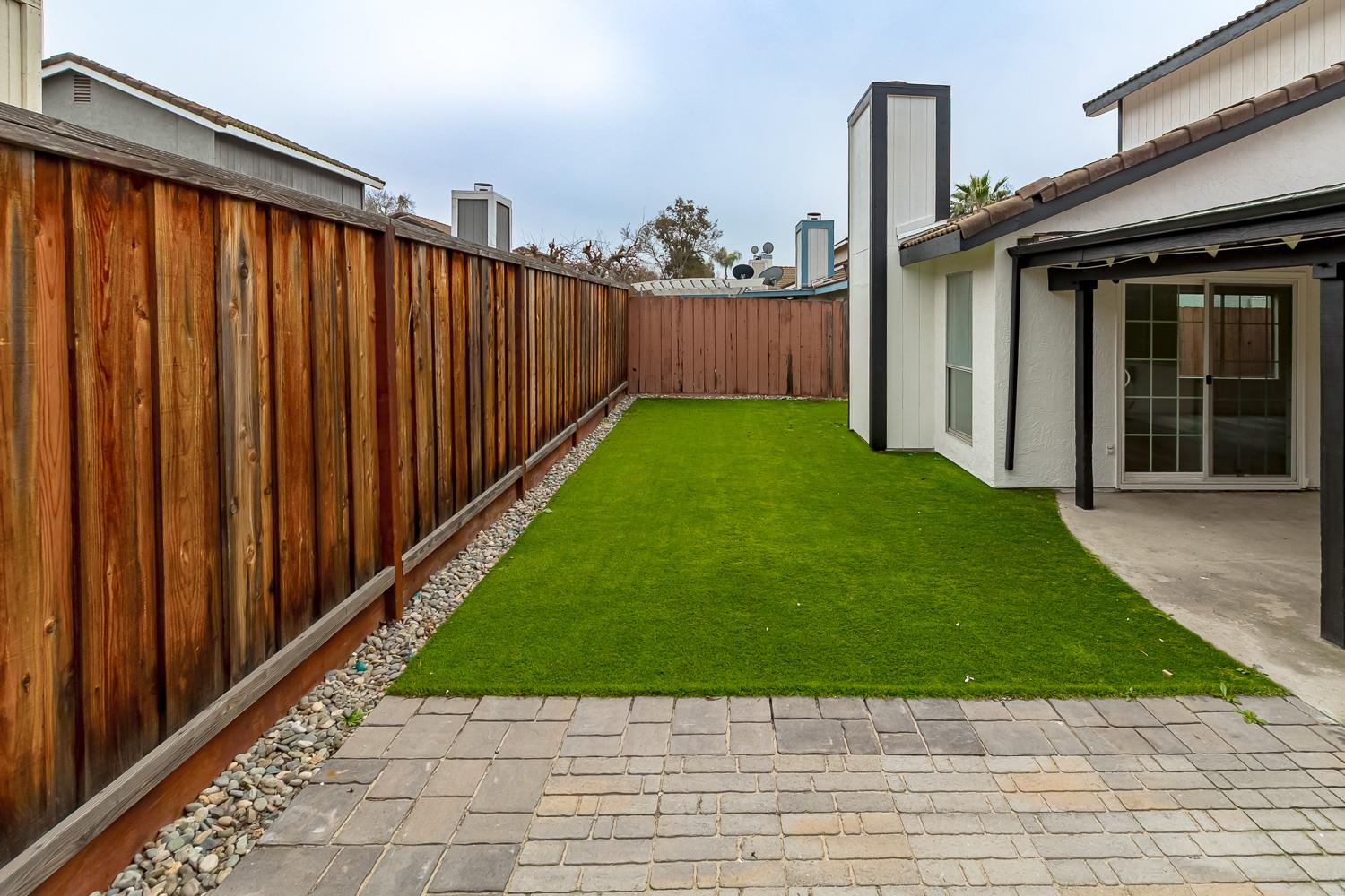 1128 Diablo Avenue Modesto, CA 95358 - Photo 23 of 23 a view of a backyard with pathway