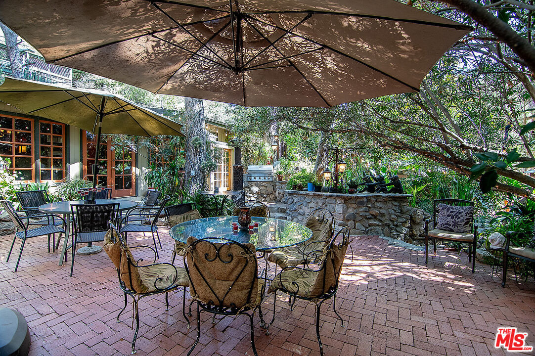 14831 Little Tujunga Canyon Road Sylmar, CA 91342 - Photo 11 of 49 a view of an outdoor space with a table and chairs under an umbrella