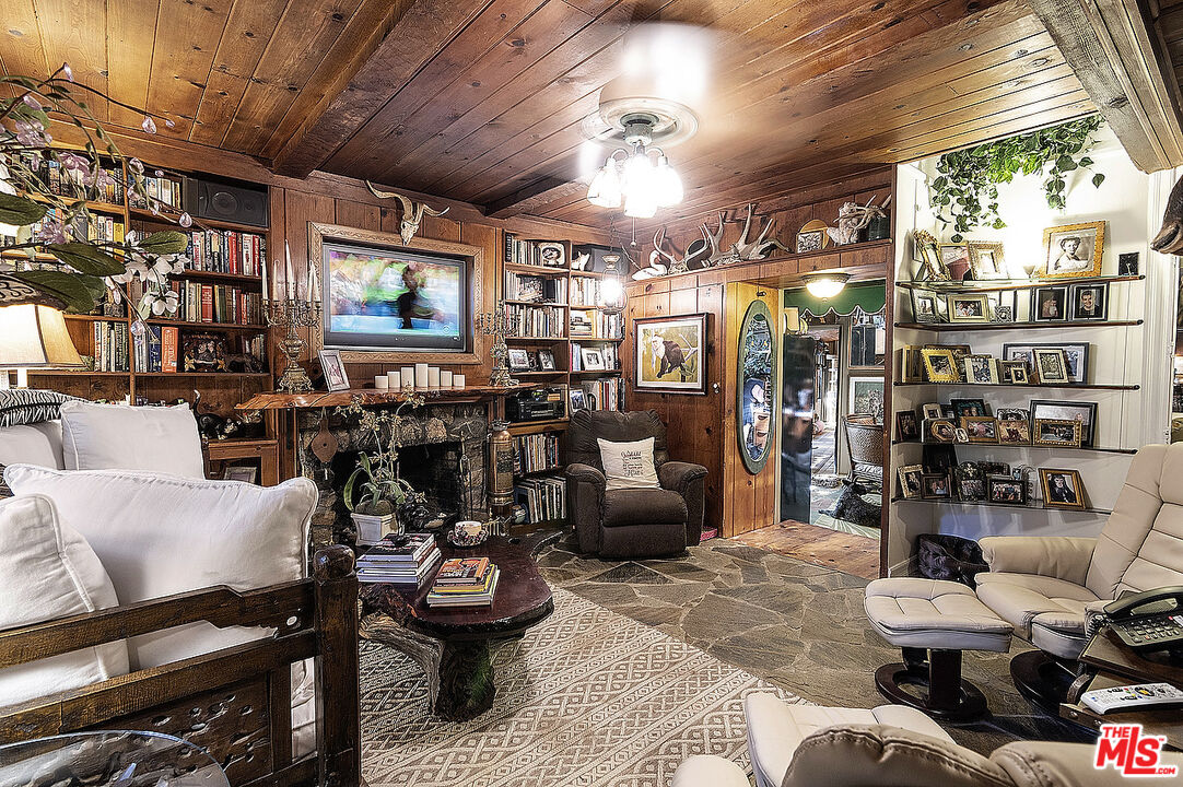 14831 Little Tujunga Canyon Road Sylmar, CA 91342 - Photo 16 of 49 a living room with furniture and a chandelier