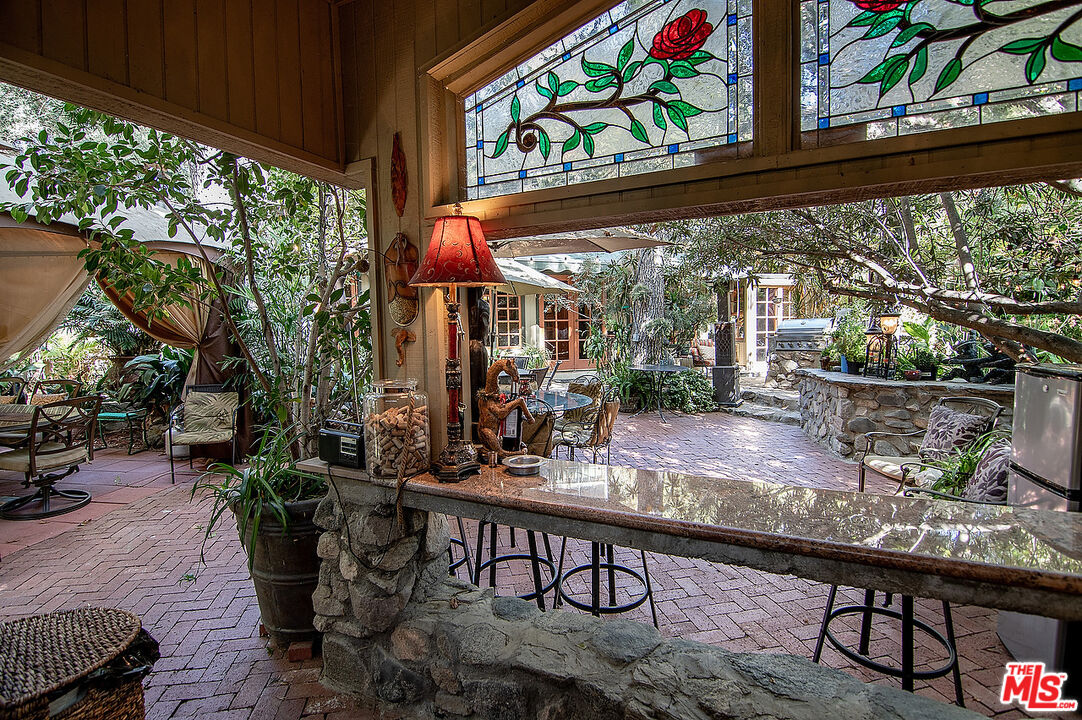 14831 Little Tujunga Canyon Road Sylmar, CA 91342 - Photo 9 of 49 a view of a chairs and table in a patio