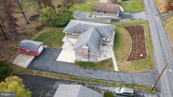 an aerial view of houses with outdoor space