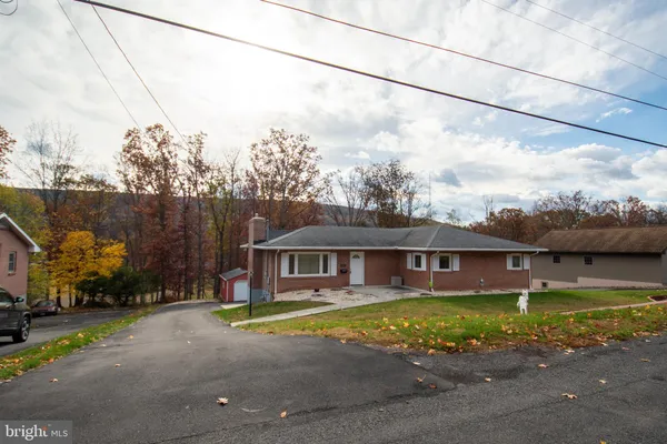 a view of a house with a big yard