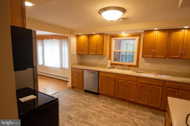 a view of hallway with wooden floor