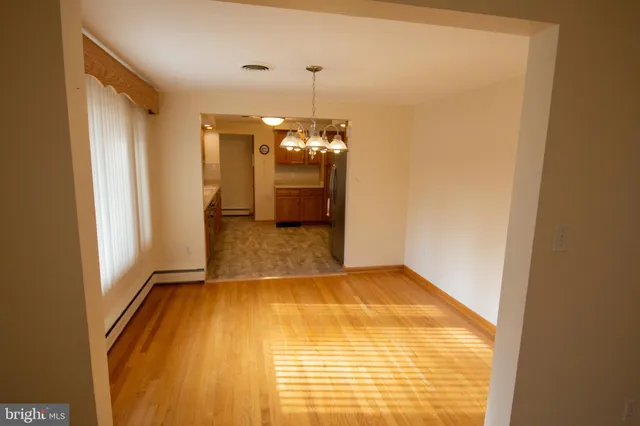 a room with window and wooden floor
