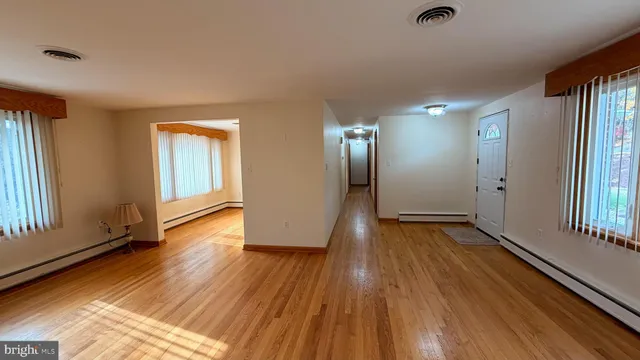 a bathroom with a shower and a sink