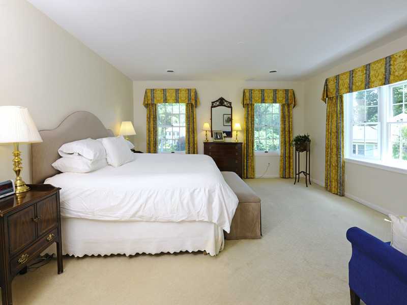 40 Winthrop Drive Riverside, CT 06878 - Photo 9 of 13 a large bed sitting in a bedroom next to a window