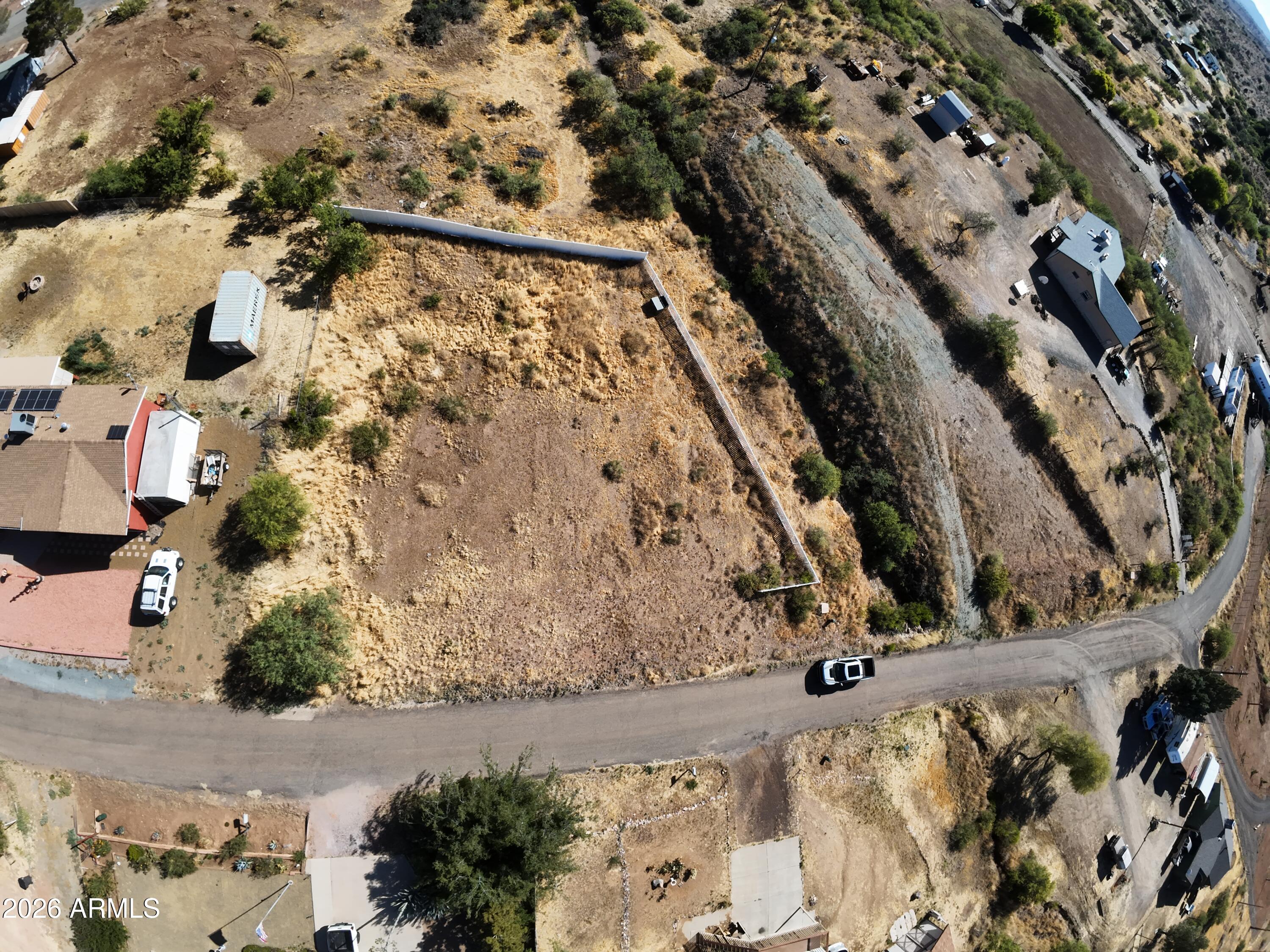 17025 East Spring Valley Road, Unit 821 Mayer, AZ 86333 - Photo 11 of 11 an aerial view of a house with a yard