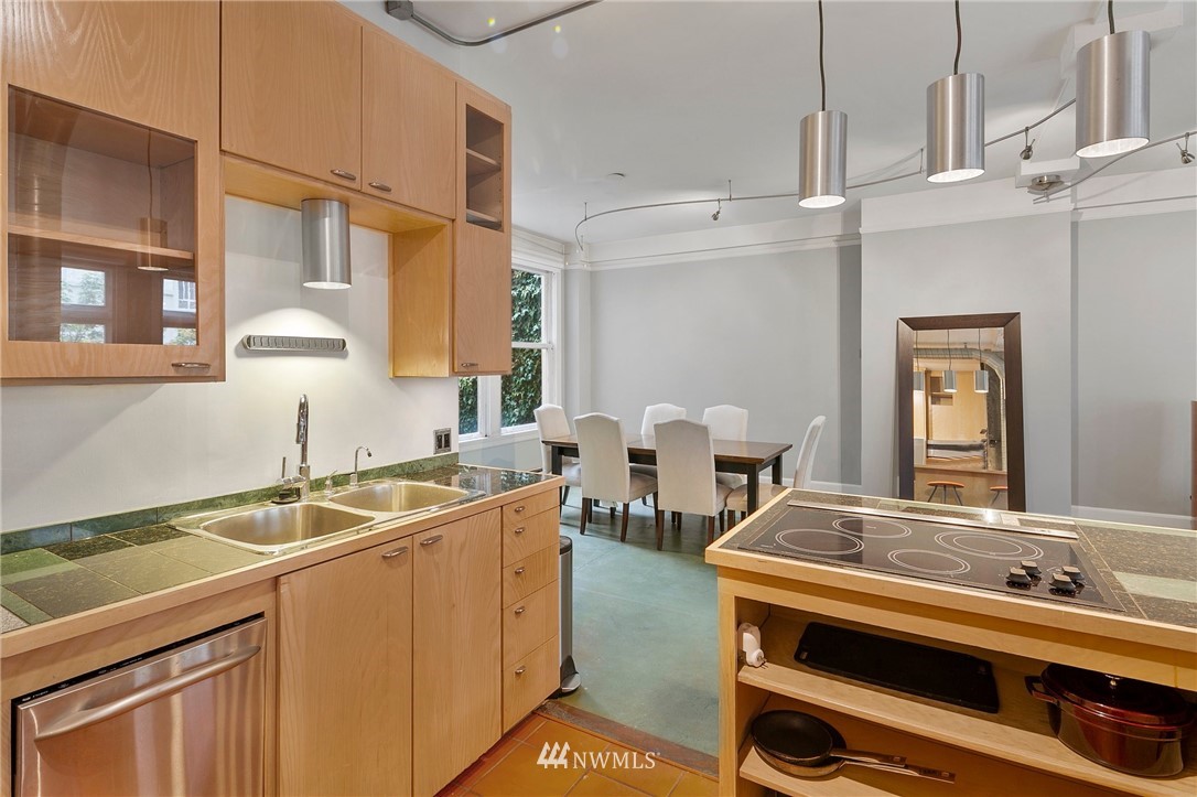 1519 3rd Avenue, Unit 302 Seattle, WA 98101 - Photo 13 of 26 a room with sink stove and utility