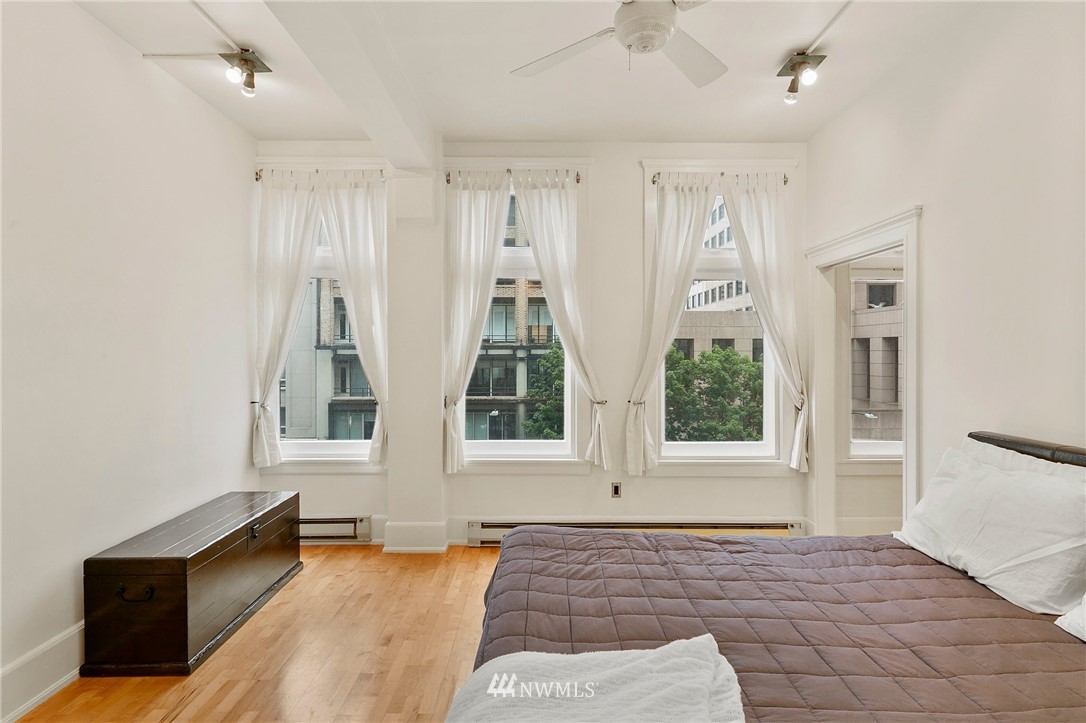 1519 3rd Avenue, Unit 302 Seattle, WA 98101 - Photo 21 of 26 a view of an empty room and window