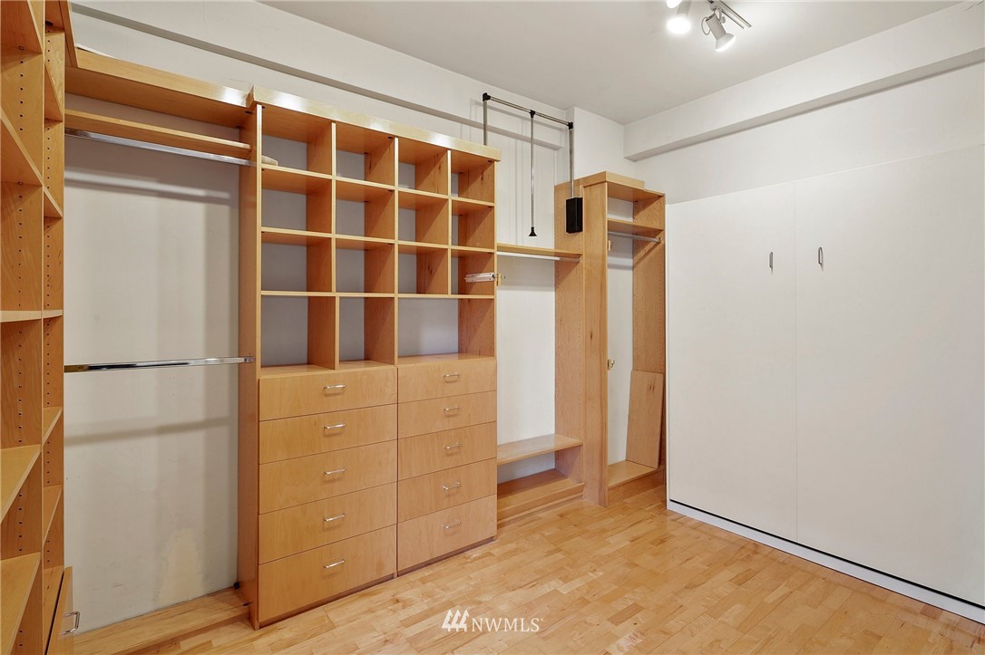 1519 3rd Avenue, Unit 302 Seattle, WA 98101 - Photo 24 of 26 a view of walk in closet with empty racks