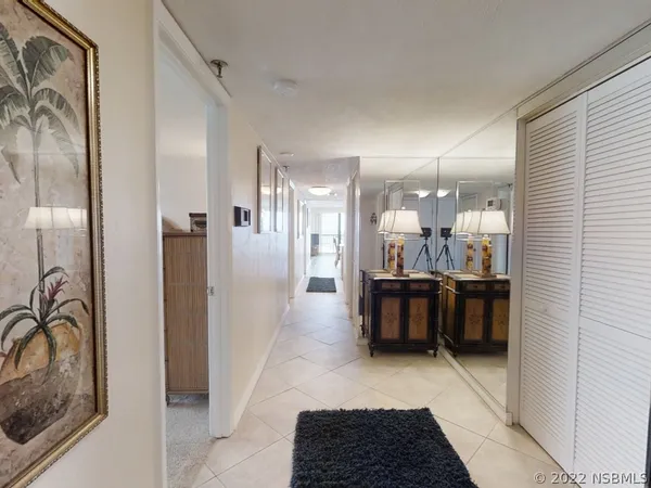 a large room with a couch and a view of living room