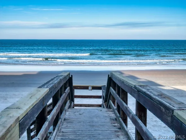 a view of a living room and wooden floor