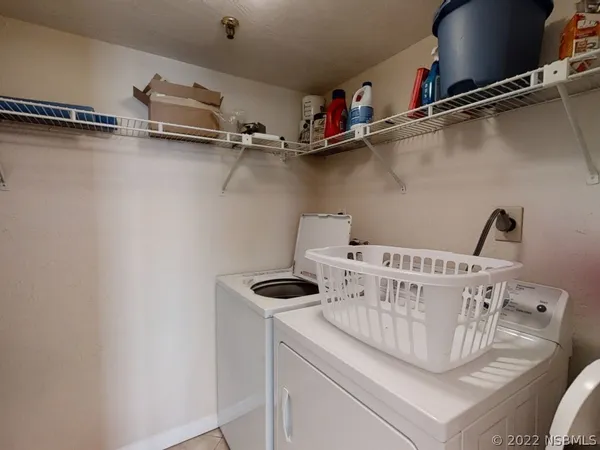 a view of a room with racks on the wall