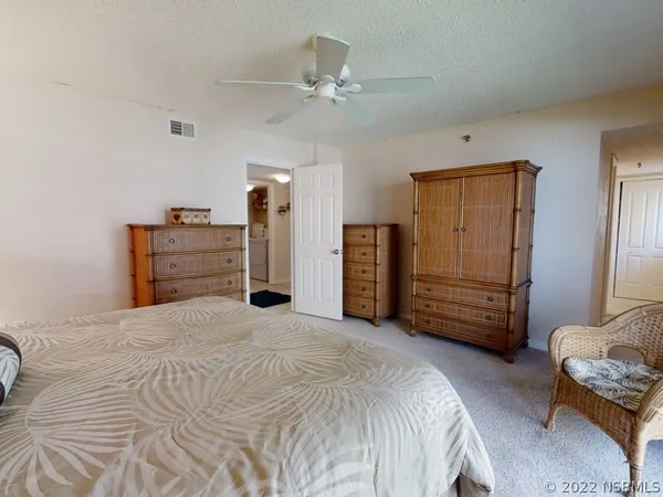 a bedroom with a bed and furniture