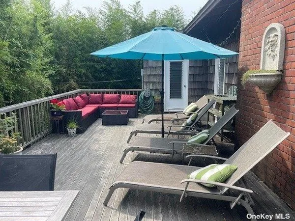 a view of a chairs and table in the patio