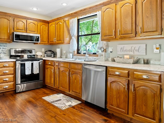 631 Short Brook Road Vincent, OH 45784 - Photo 11 of 31 Kitchen featuring appliances with stainless steel finishes, a sink, light countertops, brown cabinets, and recessed lighting