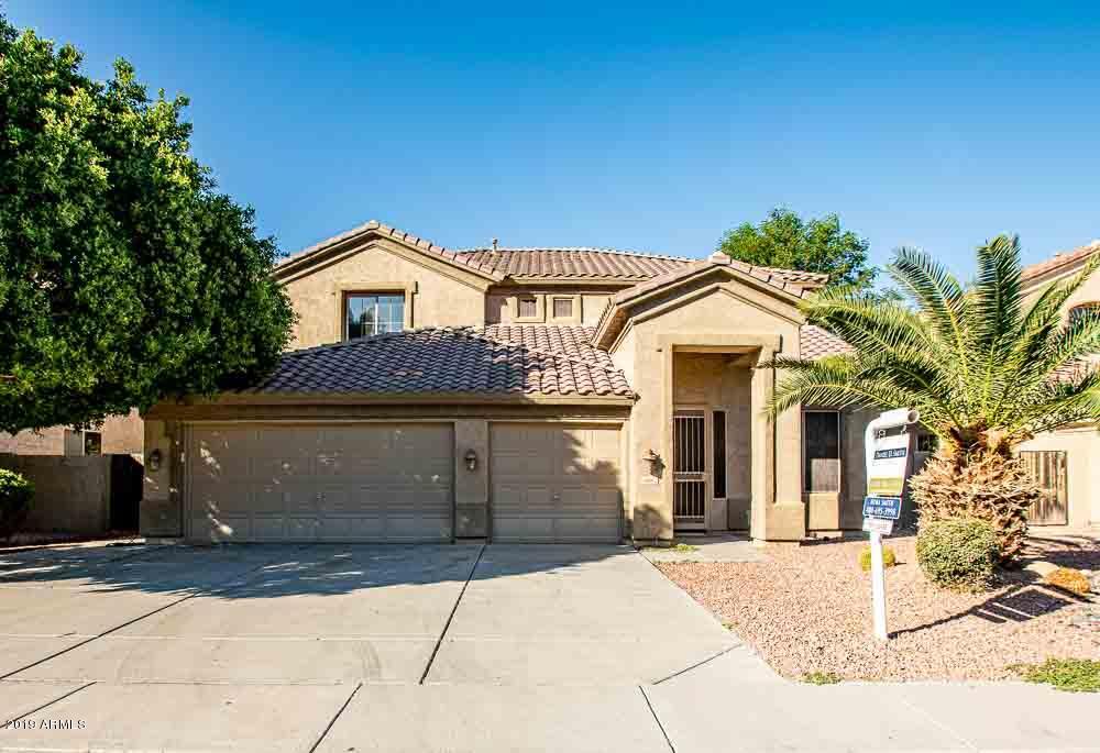 484 East Ranch Road Gilbert, AZ 85296 - Photo 1 of 36 a front view of a house with a yard and garage