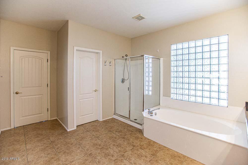 484 East Ranch Road Gilbert, AZ 85296 - Photo 11 of 36 a bathroom with a bathtub and a shower