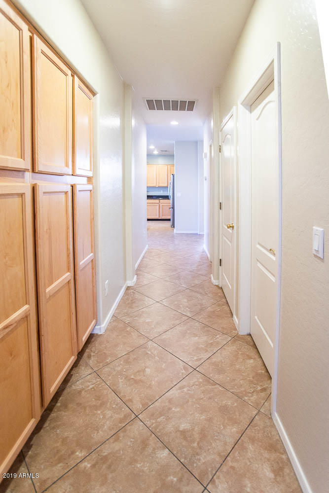 484 East Ranch Road Gilbert, AZ 85296 - Photo 18 of 36 a view of a hallway with wooden shelves