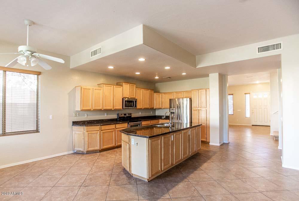 484 East Ranch Road Gilbert, AZ 85296 - Photo 2 of 36 a kitchen with stainless steel appliances granite countertop a stove and a sink