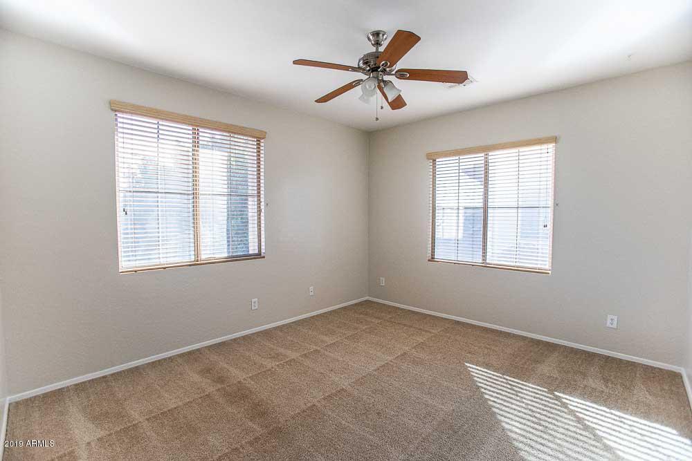484 East Ranch Road Gilbert, AZ 85296 - Photo 22 of 36 a view of a livingroom with a ceiling fan and window