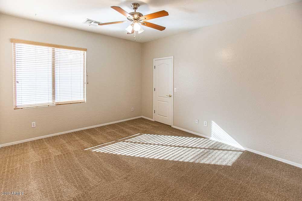 484 East Ranch Road Gilbert, AZ 85296 - Photo 26 of 36 a view of an empty room with window and chandelier fan