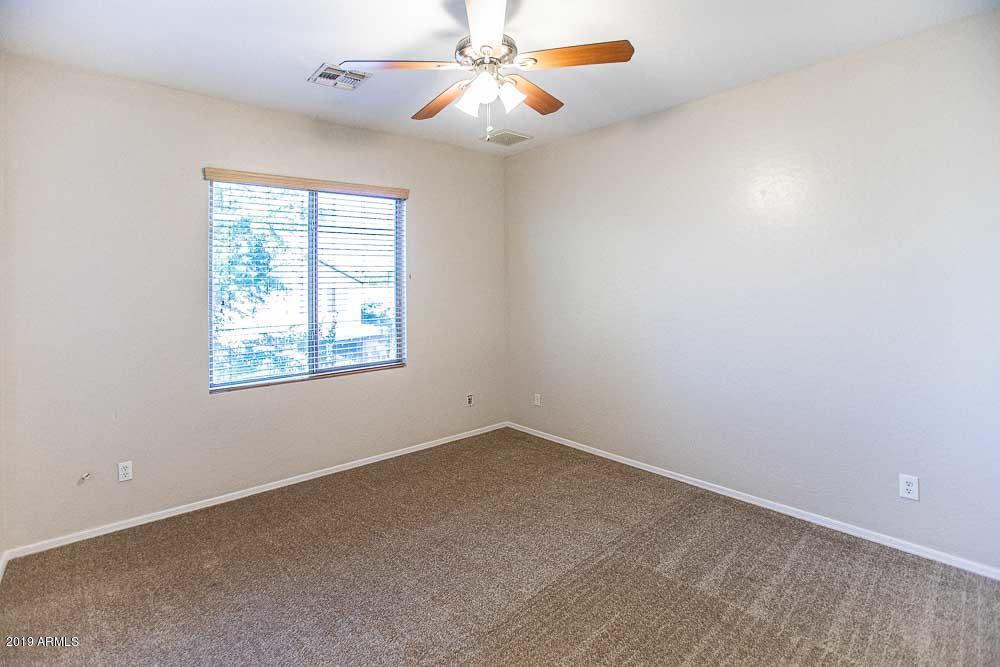 484 East Ranch Road Gilbert, AZ 85296 - Photo 28 of 36 an empty room with windows and fan