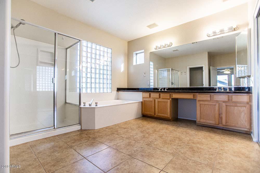 484 East Ranch Road Gilbert, AZ 85296 - Photo 32 of 36 a large bathroom with a large tub shower and sink