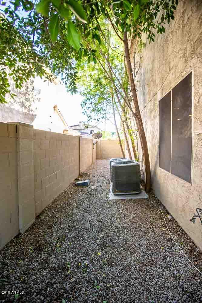 484 East Ranch Road Gilbert, AZ 85296 - Photo 34 of 36 a view of a backyard with large tree