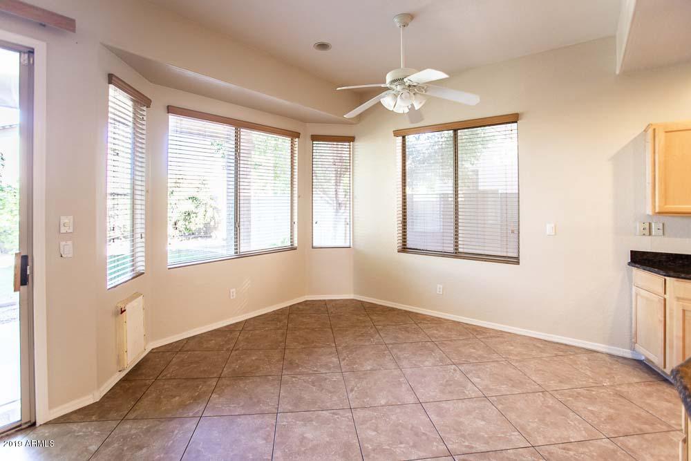 484 East Ranch Road Gilbert, AZ 85296 - Photo 5 of 36 a view of an empty room with chandelier and a window