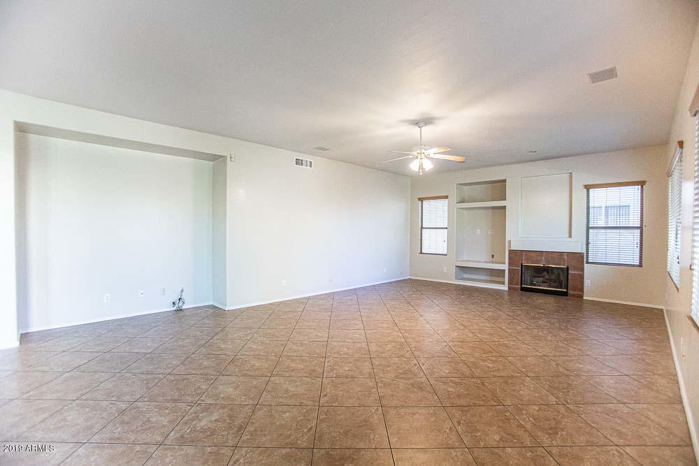 484 East Ranch Road Gilbert, AZ 85296 - Photo 6 of 36 a view of an empty room with window and fireplace