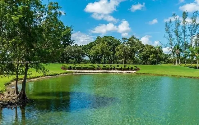 a view of a golf course with a lake
