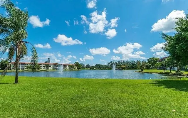 a view of a golf course with a lake view