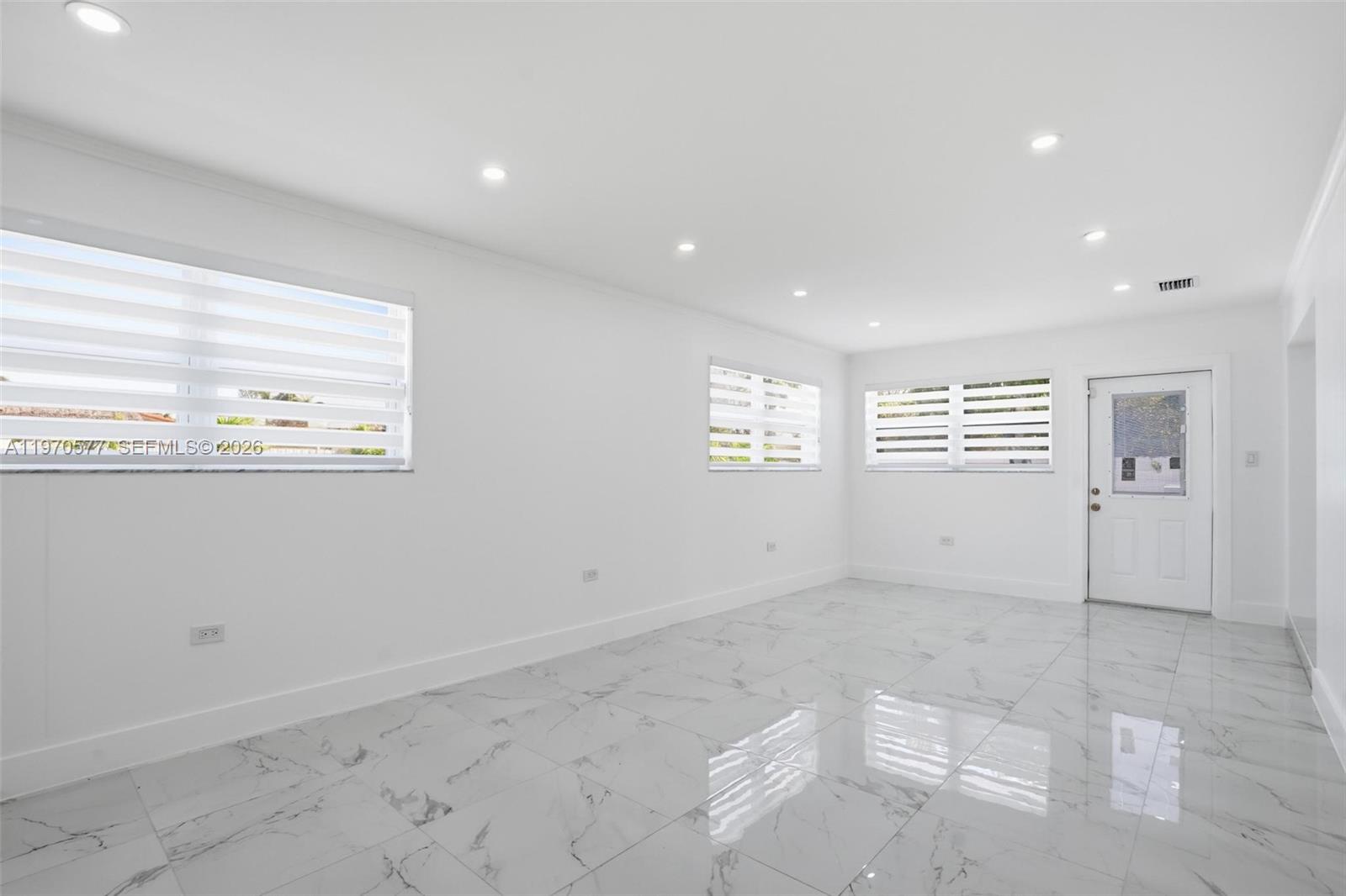 5521 Southwest 104th Avenue Miami, FL 33165 - Photo 11 of 28 a view of an empty room and a window