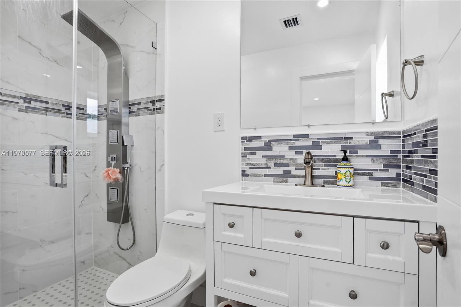 5521 Southwest 104th Avenue Miami, FL 33165 - Photo 15 of 28 a bathroom with a sink toilet and shower