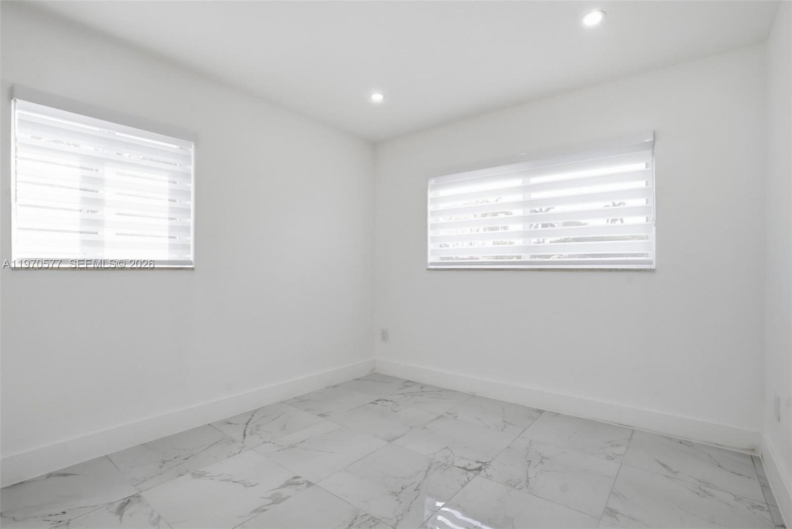 5521 Southwest 104th Avenue Miami, FL 33165 - Photo 16 of 28 an empty room with a window