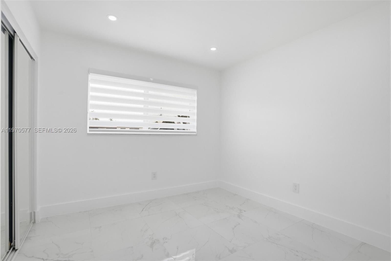 5521 Southwest 104th Avenue Miami, FL 33165 - Photo 17 of 28 an empty room with a window