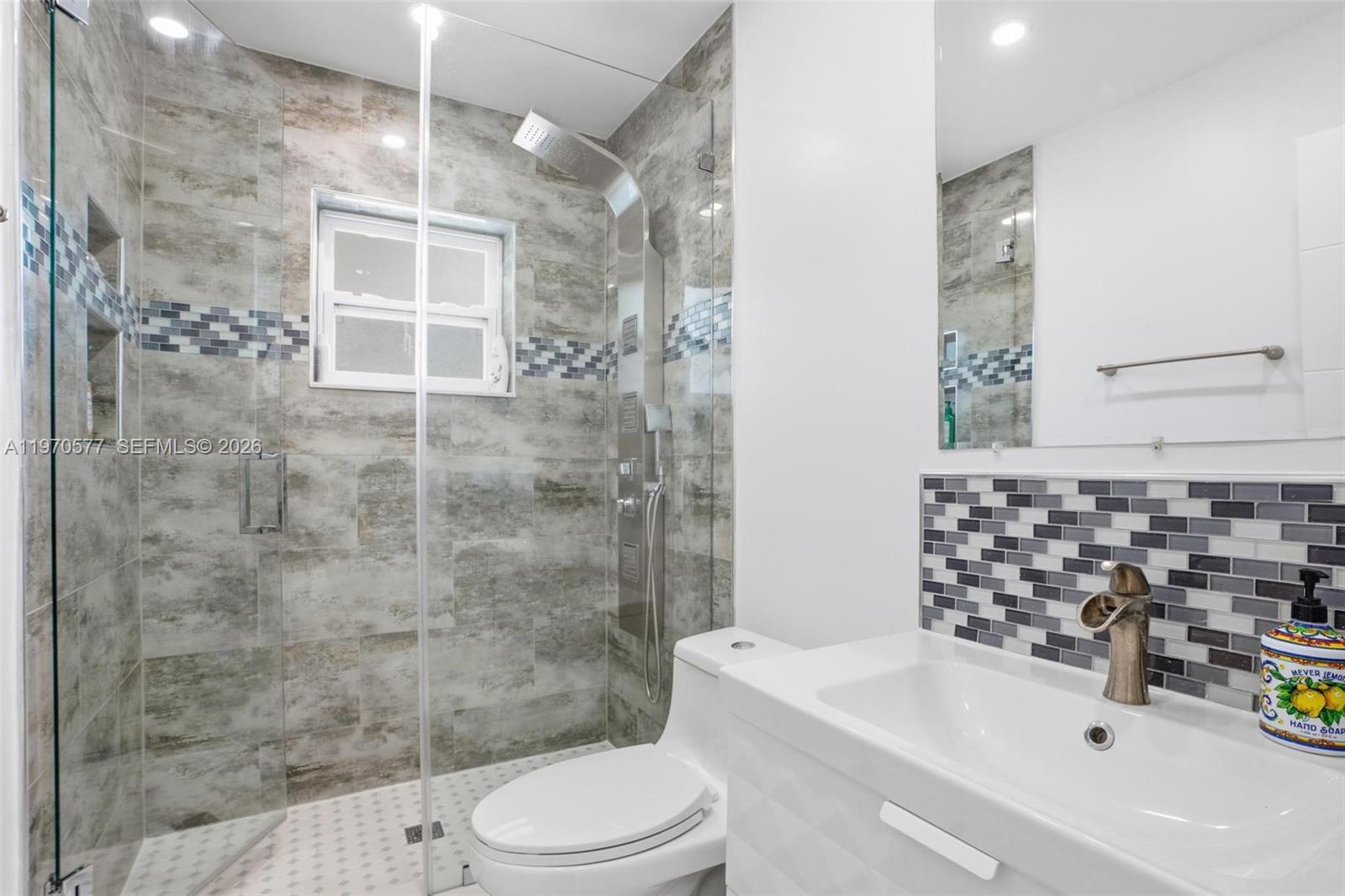 5521 Southwest 104th Avenue Miami, FL 33165 - Photo 18 of 28 a bathroom with a sink a toilet and shower