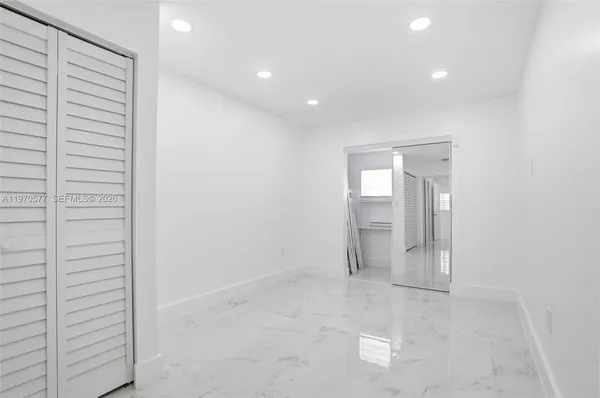 a bathroom with a shower a toilet and a mirror